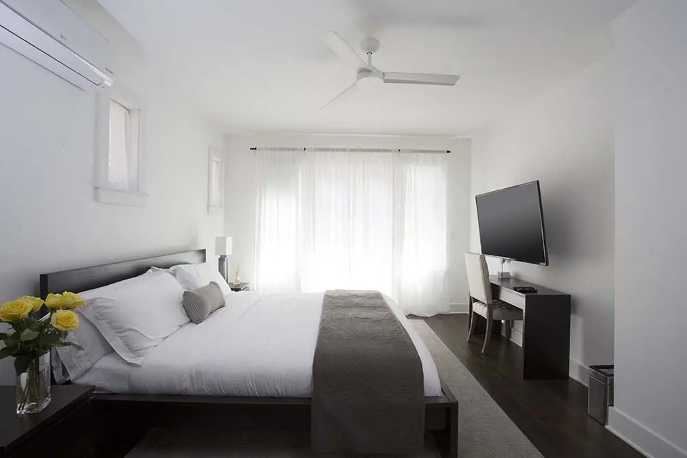 bedroom with king bed, desk and TV