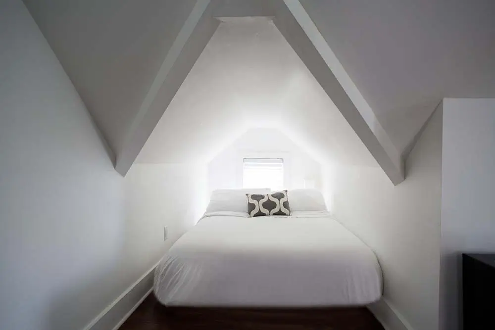 Bed tucked into dormer