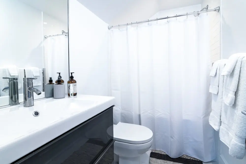 Bathroom stocked with towels and soap ready for guests.