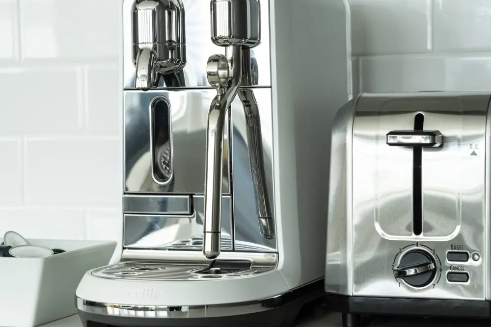 Stainless steel espresso maker and toaster.